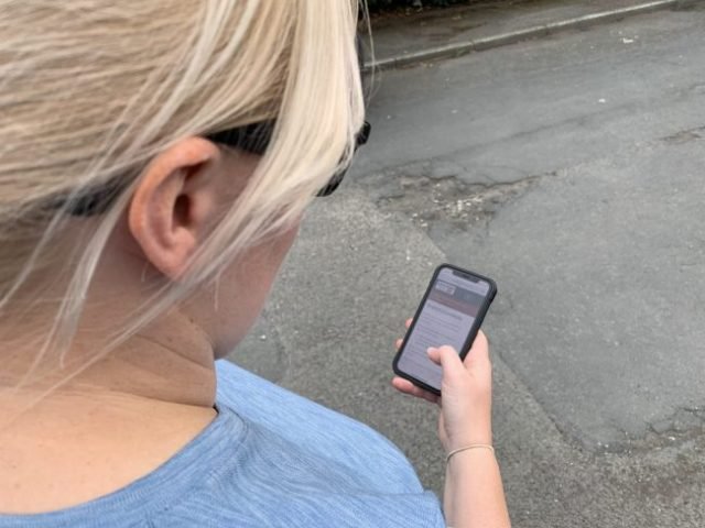 LCCStockReportingPotholeOnPhone