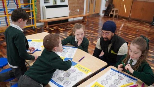 Pupils at St Paul & St Timothy’s Catholic Infant School take part in an egg-painting art workshop with commissioned artist Amrit Singh © MrASingh
