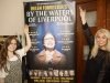 Emma Mulligan and Leanne Campbell meet in rehearsals with banner. Credit David Munn