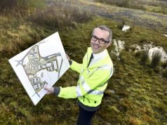 Cllr Aidy Riggott with the plans for Lancashire Central