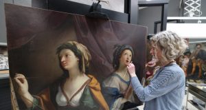 Rebecca Kench, painting conservator, works on Giovanni Andrea Sirani’s Allegory of Painting and Music. c. Gareth Jones